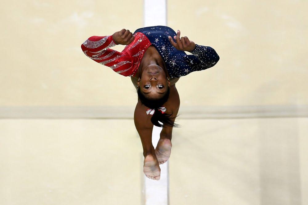 Getty uses an overhead robot camera to capture American gymnast Simone Biles on the balance beam.